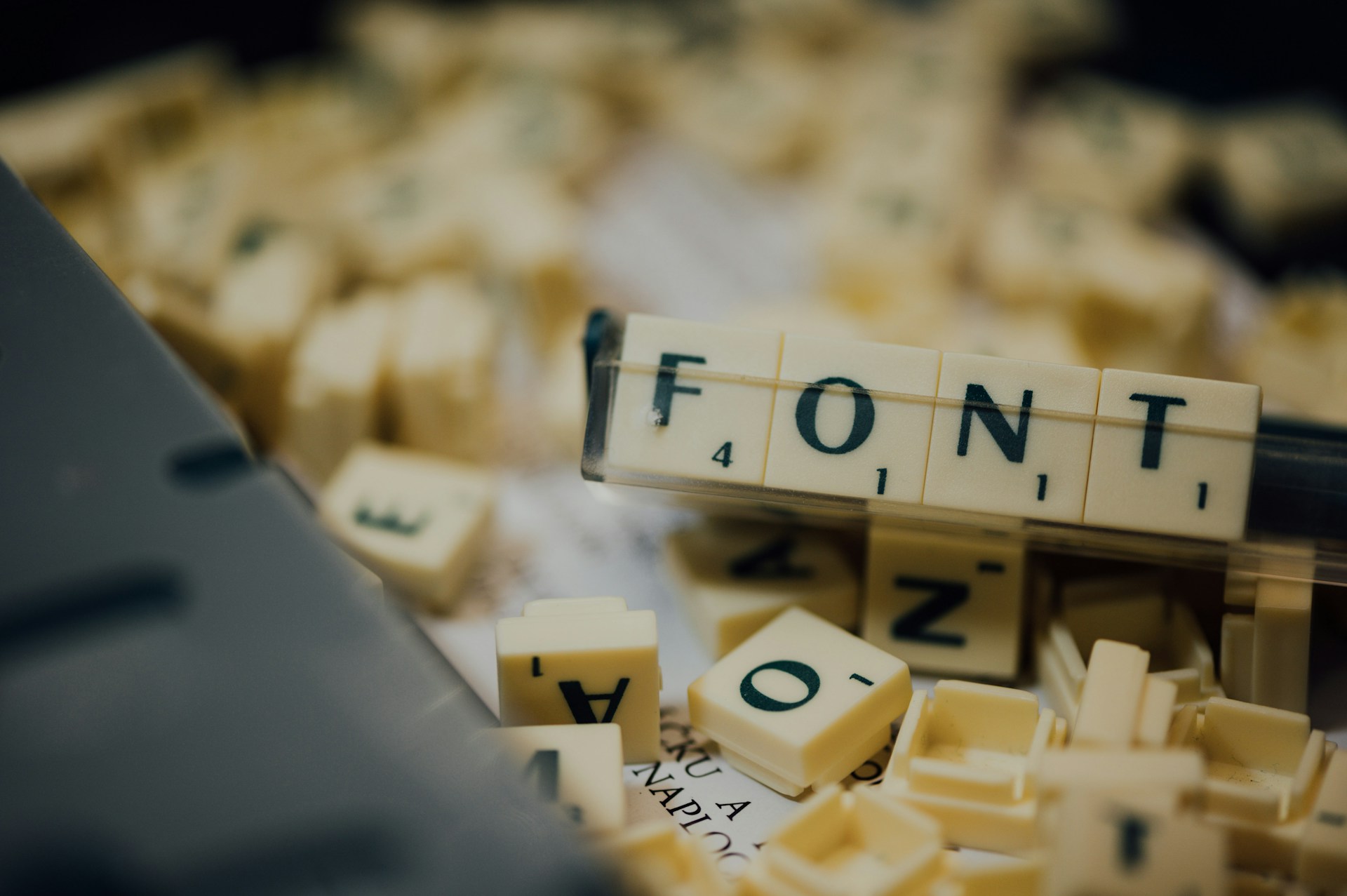scrabble pieces spelling out the word font